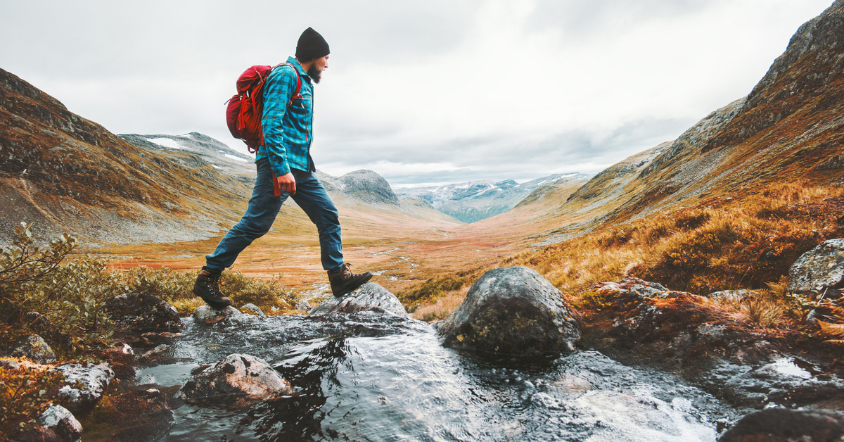 a man riding on top of a mountain