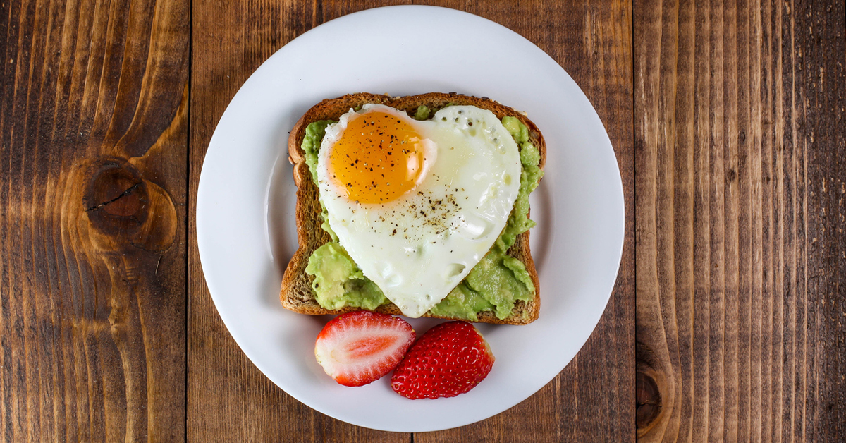 a plate of food sitting on top of a wooden table