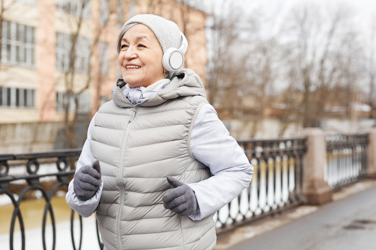 A senior woman running during winter in Alabama.