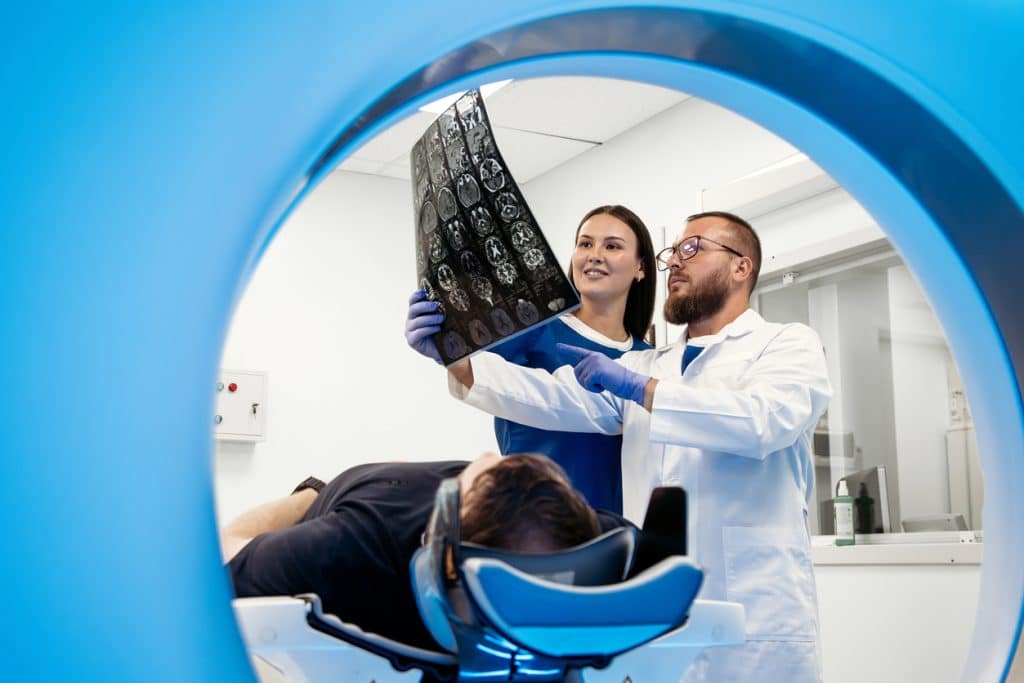Doctors at UAB Medical West looking at CT scan results.