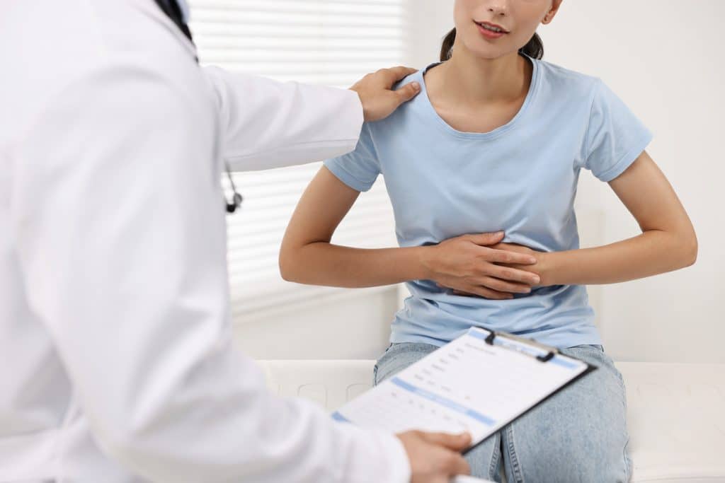 A patient explaining changes in their bowl movements to a doctor at UAB Medical West 