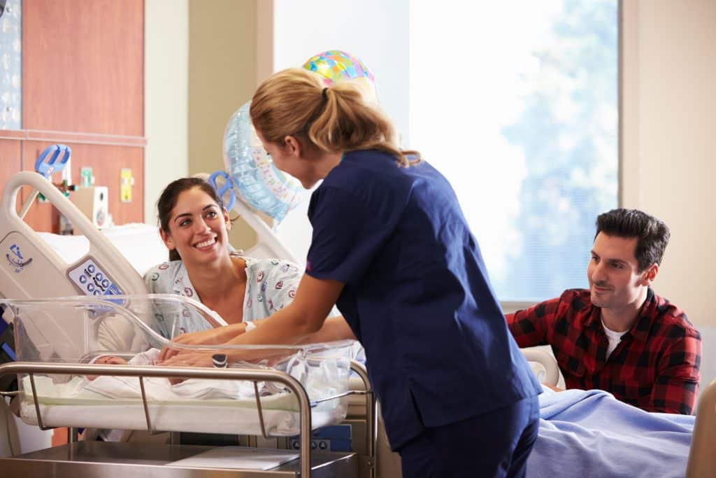 A nurse assisting a newborn in a level II neonatal nursery at UAB medical west